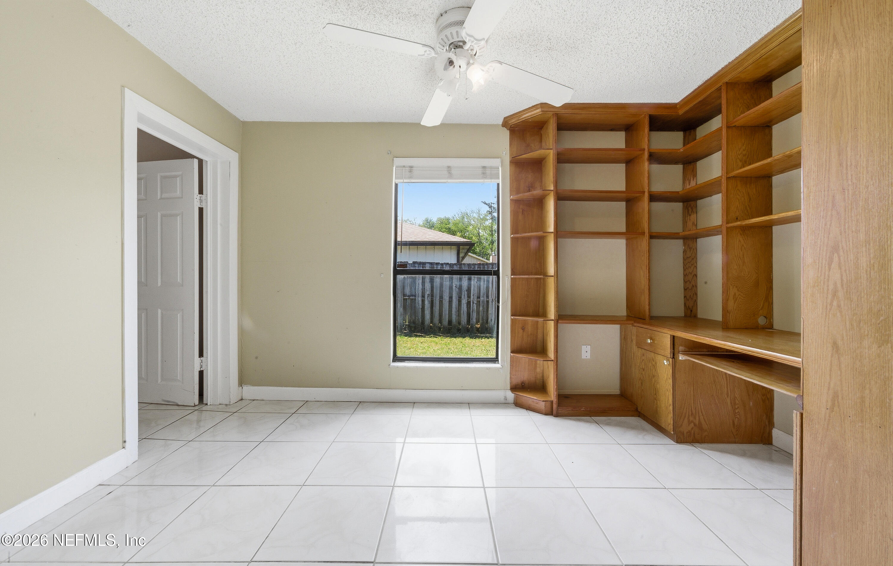 1722 Farm Way Middleburg, FL 32068 - Photo 5 of 37 an empty room with windows and cabinet