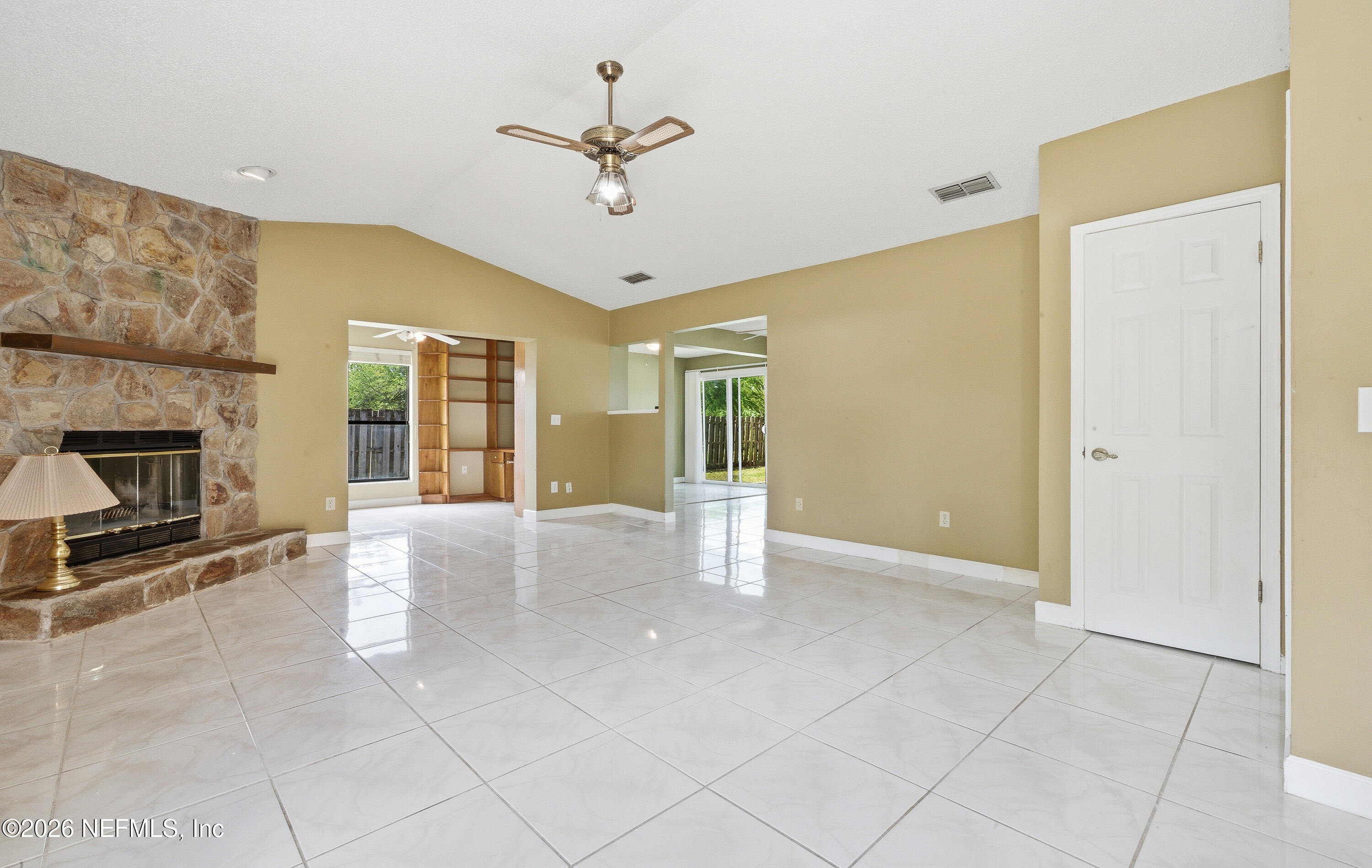 1722 Farm Way Middleburg, FL 32068 - Photo 9 of 37 a view of an empty room with a fireplace