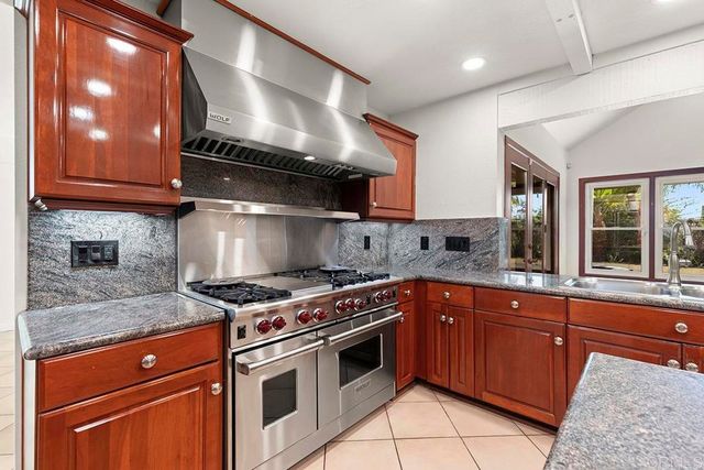 a view of a hallway with wooden shelves