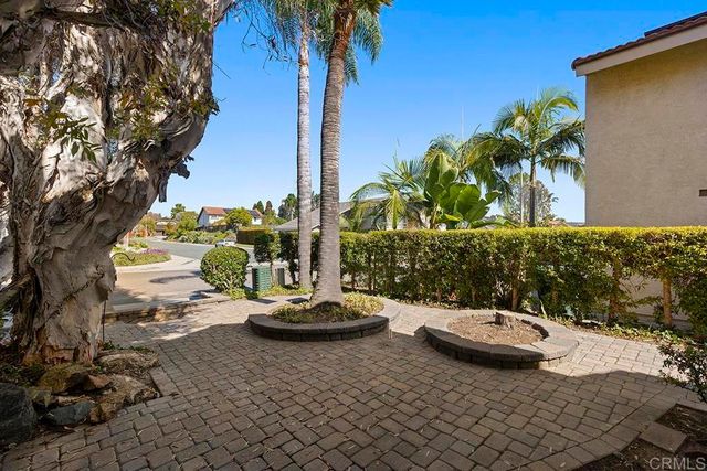 a view of a backyard and a patio