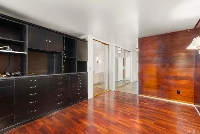 a bathroom with a granite countertop sink a toilet and a bathtub