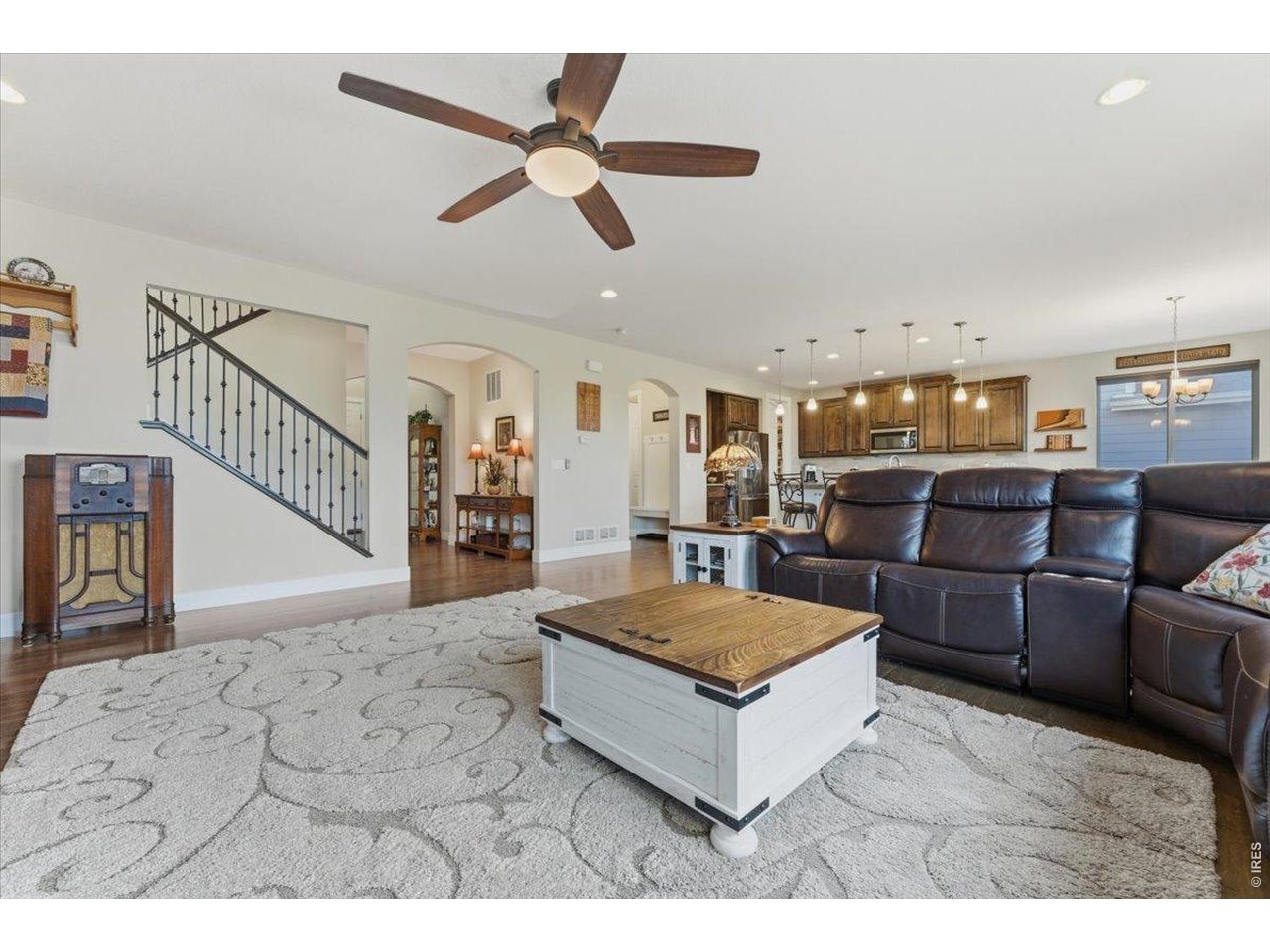 1148 Wagon Bend Road Berthoud, CO 80513 - Photo 13 of 50 Great room facing stairs, front entry, mudroom, pantry, and kitchen