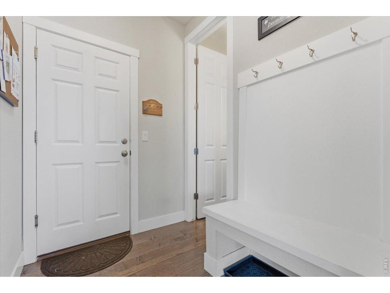 1148 Wagon Bend Road Berthoud, CO 80513 - Photo 15 of 50 Mud room off kitchen looking at garage door and 1/2 bathroom