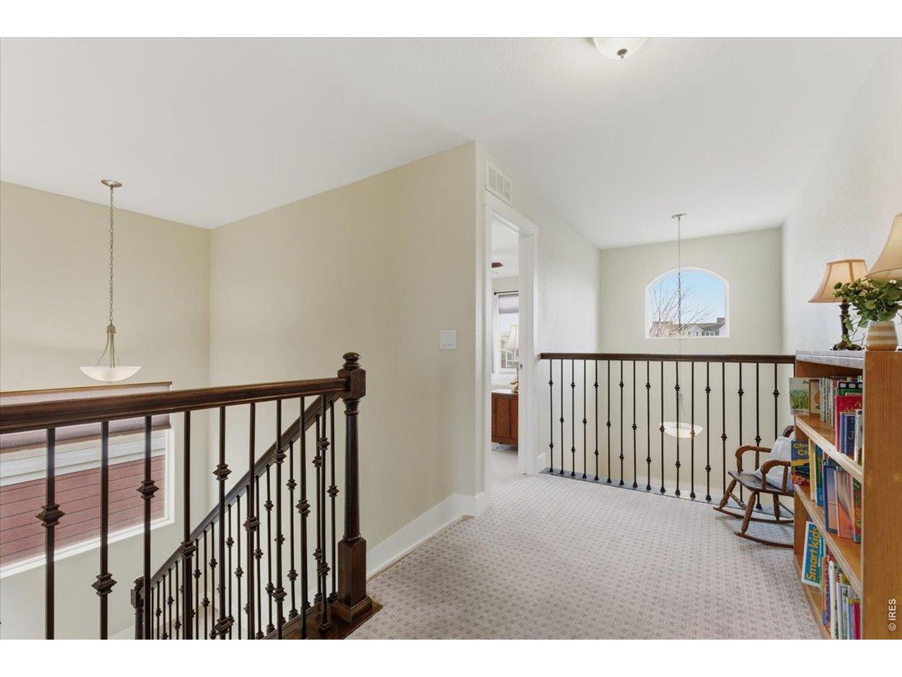 1148 Wagon Bend Road Berthoud, CO 80513 - Photo 19 of 50 2nd floor landing facing bedroom and balcony overlooking 1st floor front door entry.