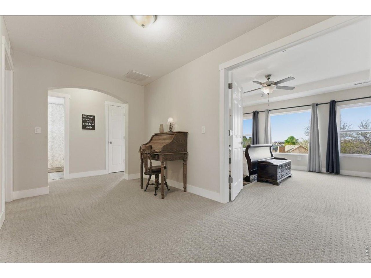 1148 Wagon Bend Road Berthoud, CO 80513 - Photo 20 of 50 2nd floor hallway, laundry room on left bedroom on the left, shared bathroom, and 2nd bedroom to the right of bathroom, and primary bedroom on the right.