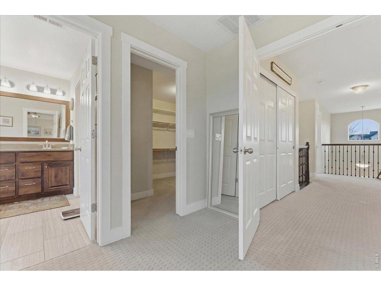 1148 Wagon Bend Road Berthoud, CO 80513 - Photo 30 of 50 Primary bedroom facing, primary bathroom, primary closet, 2nd floor landing and balcony