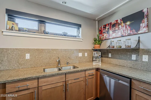 a kitchen with a sink and cabinets