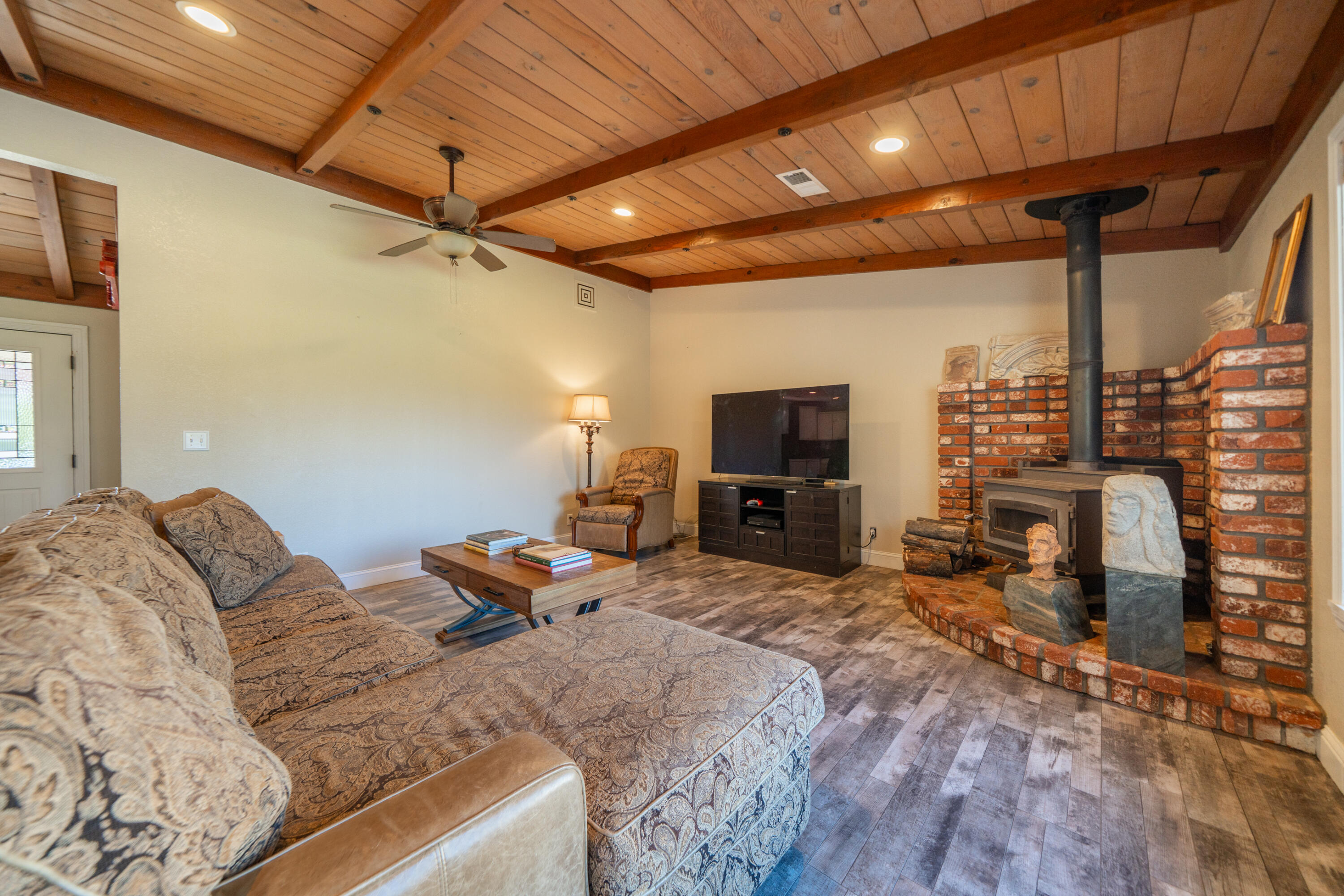 7273 Amigo Way Redding, CA 96002 - Photo 14 of 59 a bedroom with furniture and a flat screen tv