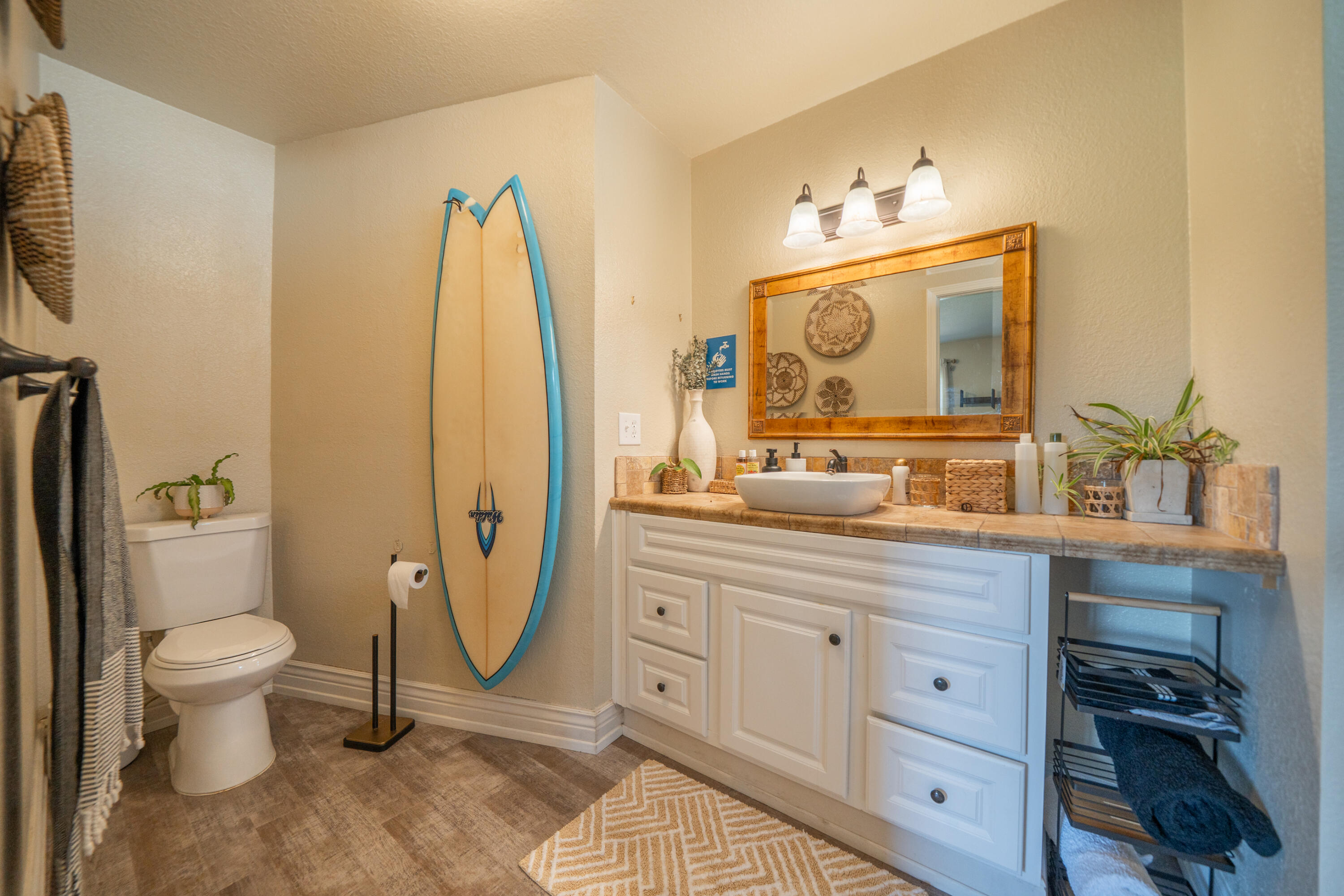 7273 Amigo Way Redding, CA 96002 - Photo 26 of 59 a spacious bathroom with a granite countertop sink a toilet and a mirror