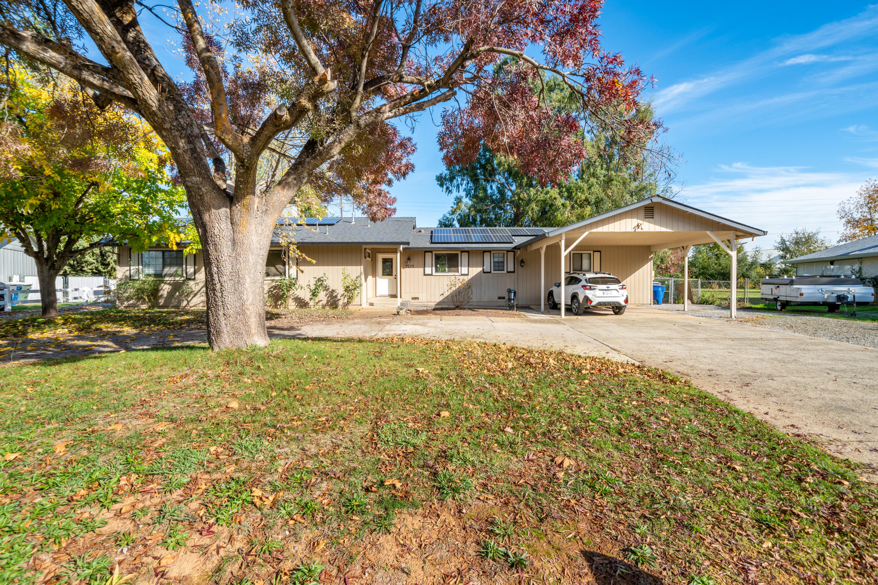 7273 Amigo Way Redding, CA 96002 - Photo 3 of 59 a front view of a house with garden