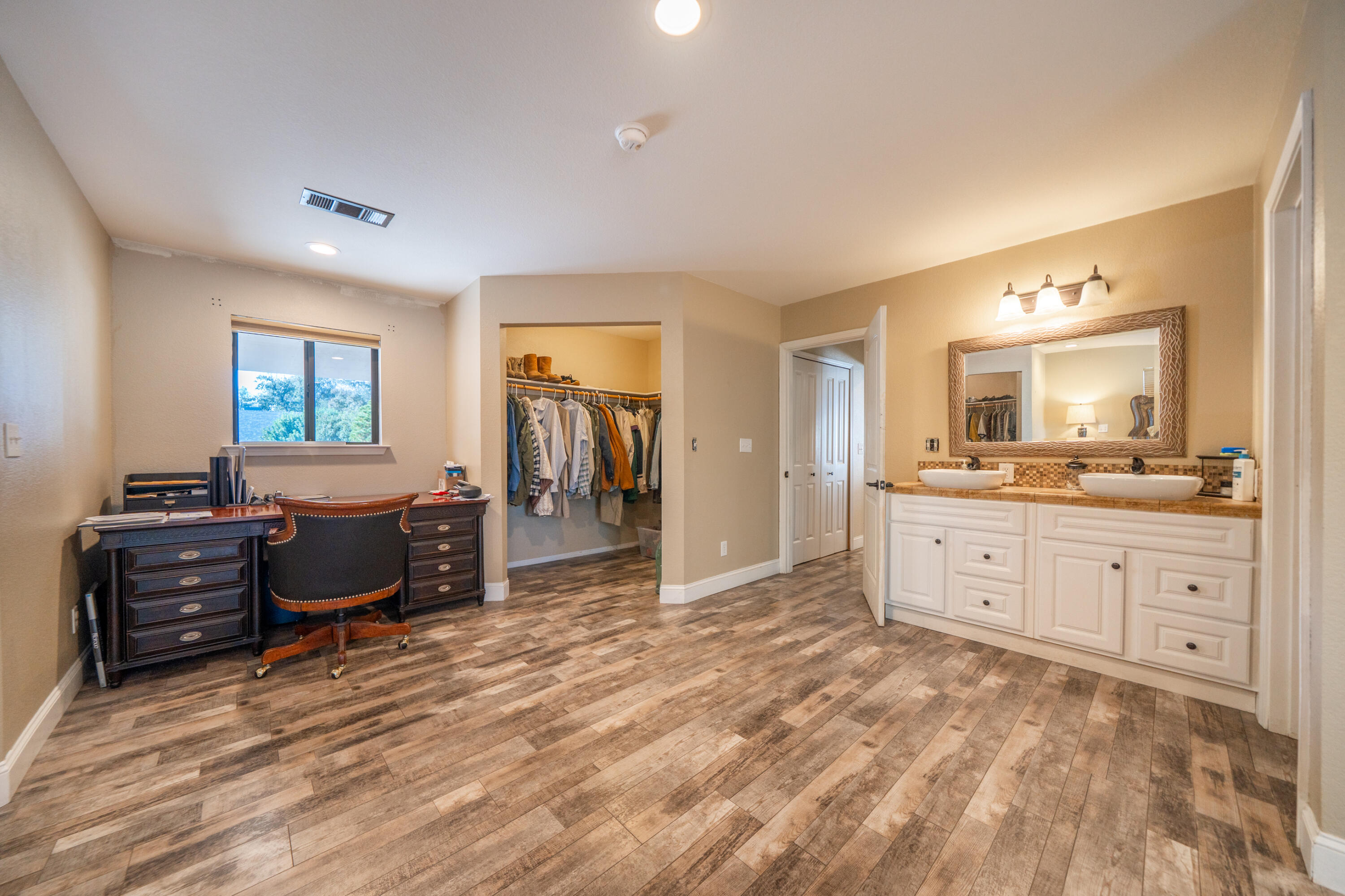 7273 Amigo Way Redding, CA 96002 - Photo 31 of 59 a spacious bedroom with a bed and a dresser