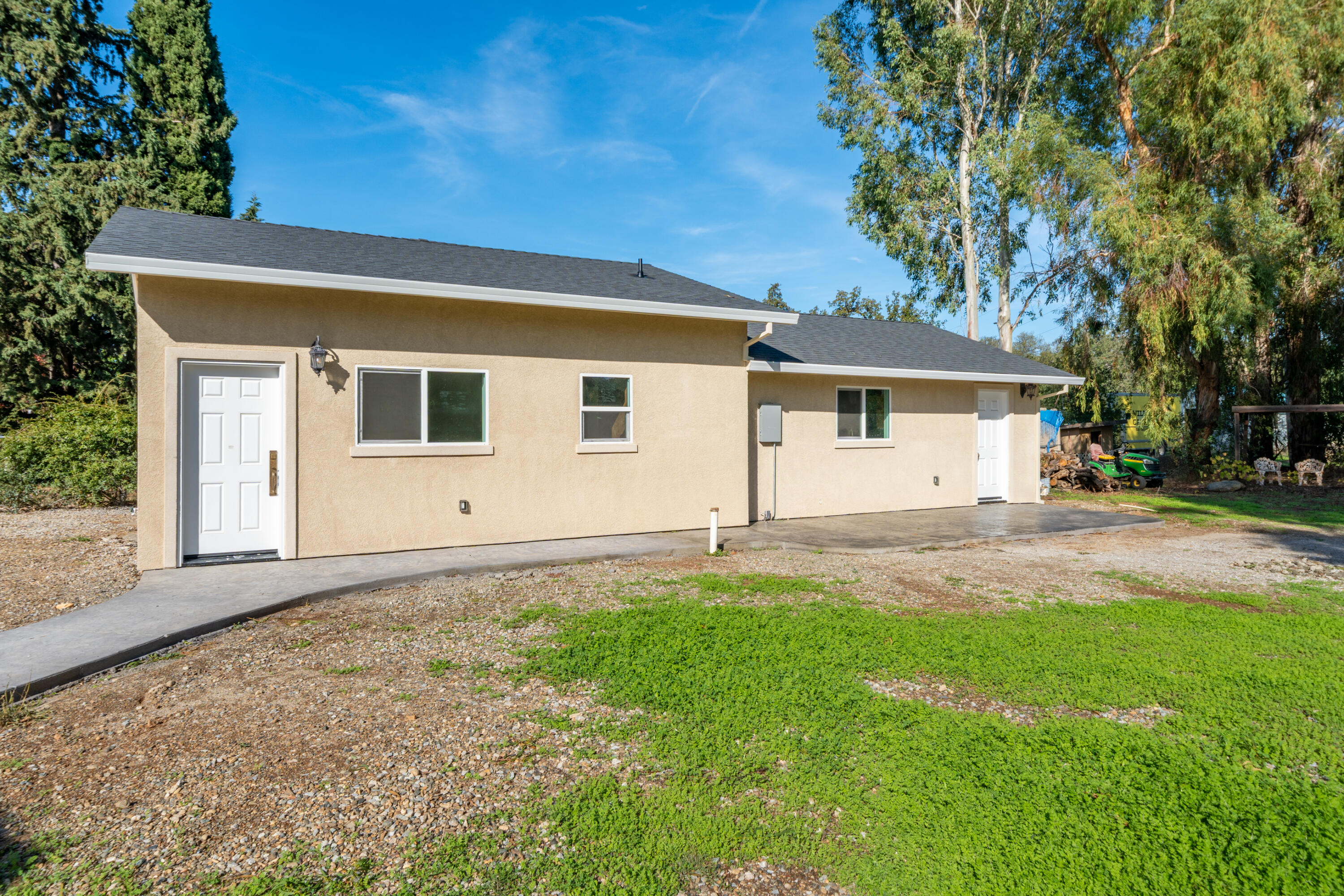 7273 Amigo Way Redding, CA 96002 - Photo 35 of 59 front view of a house with a yard