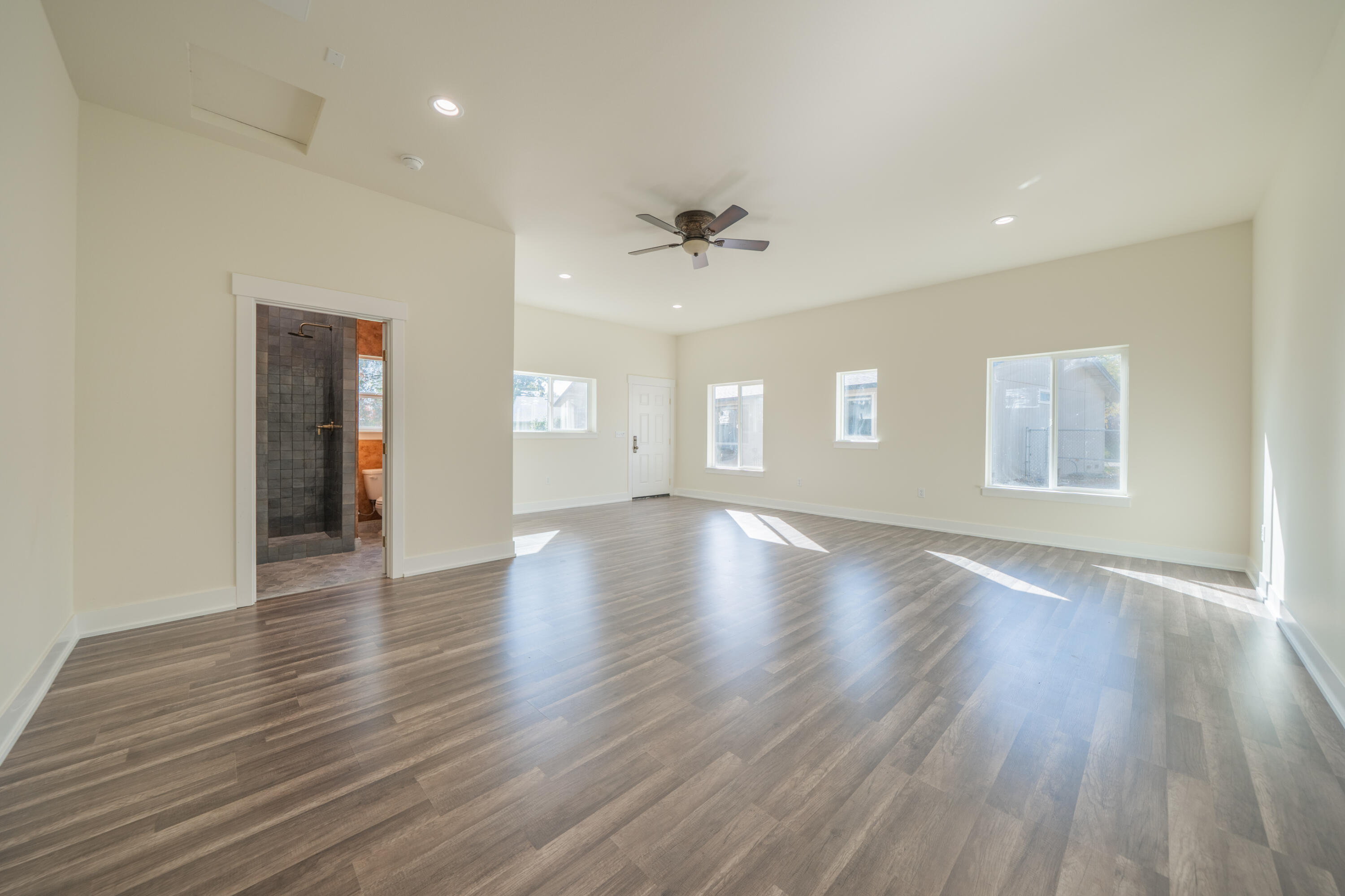 7273 Amigo Way Redding, CA 96002 - Photo 39 of 59 a view of an empty room with window and wooden floor