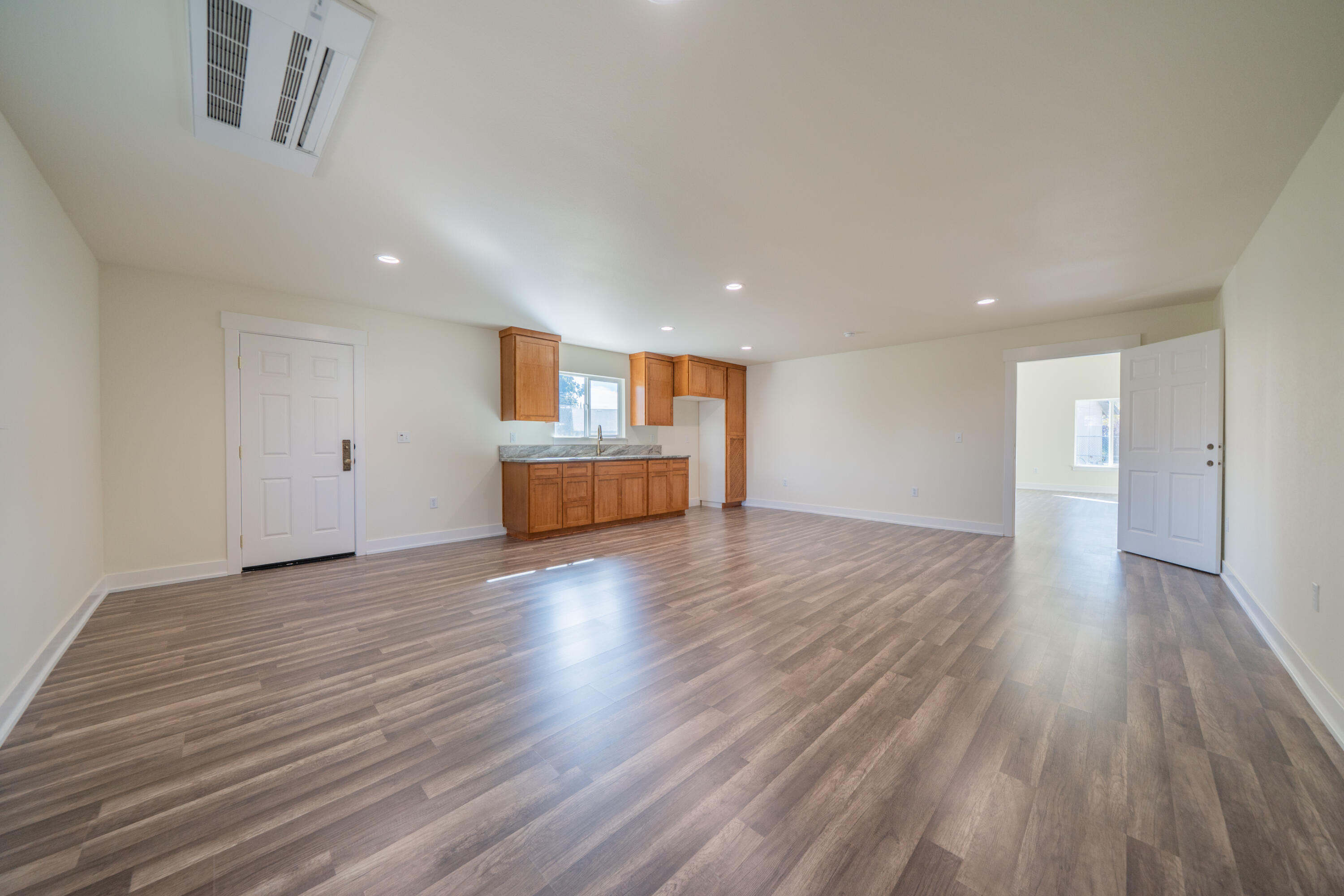 7273 Amigo Way Redding, CA 96002 - Photo 42 of 59 a view of empty room with wooden floor
