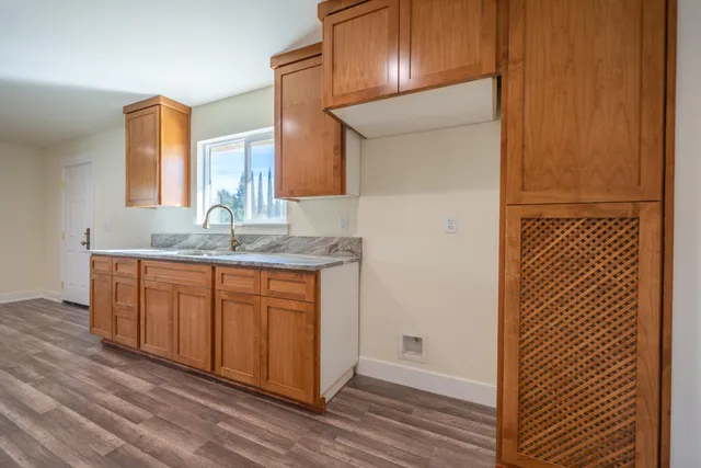 a view of backyard with a patio and wooden floor