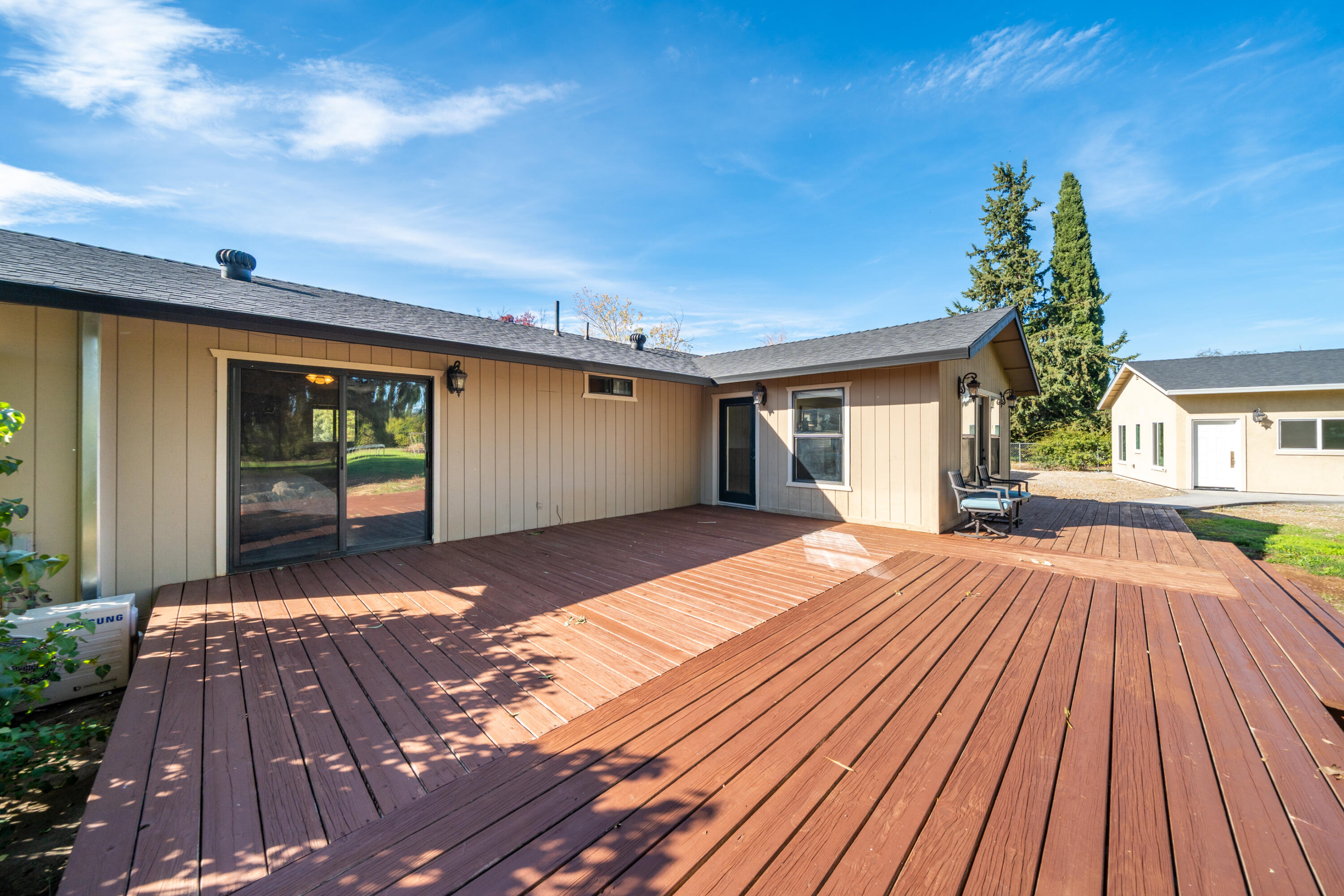 7273 Amigo Way Redding, CA 96002 - Photo 49 of 59 a view of backyard with a patio and wooden floor