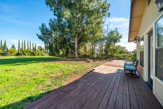 a front view of a house with a yard table and chairs