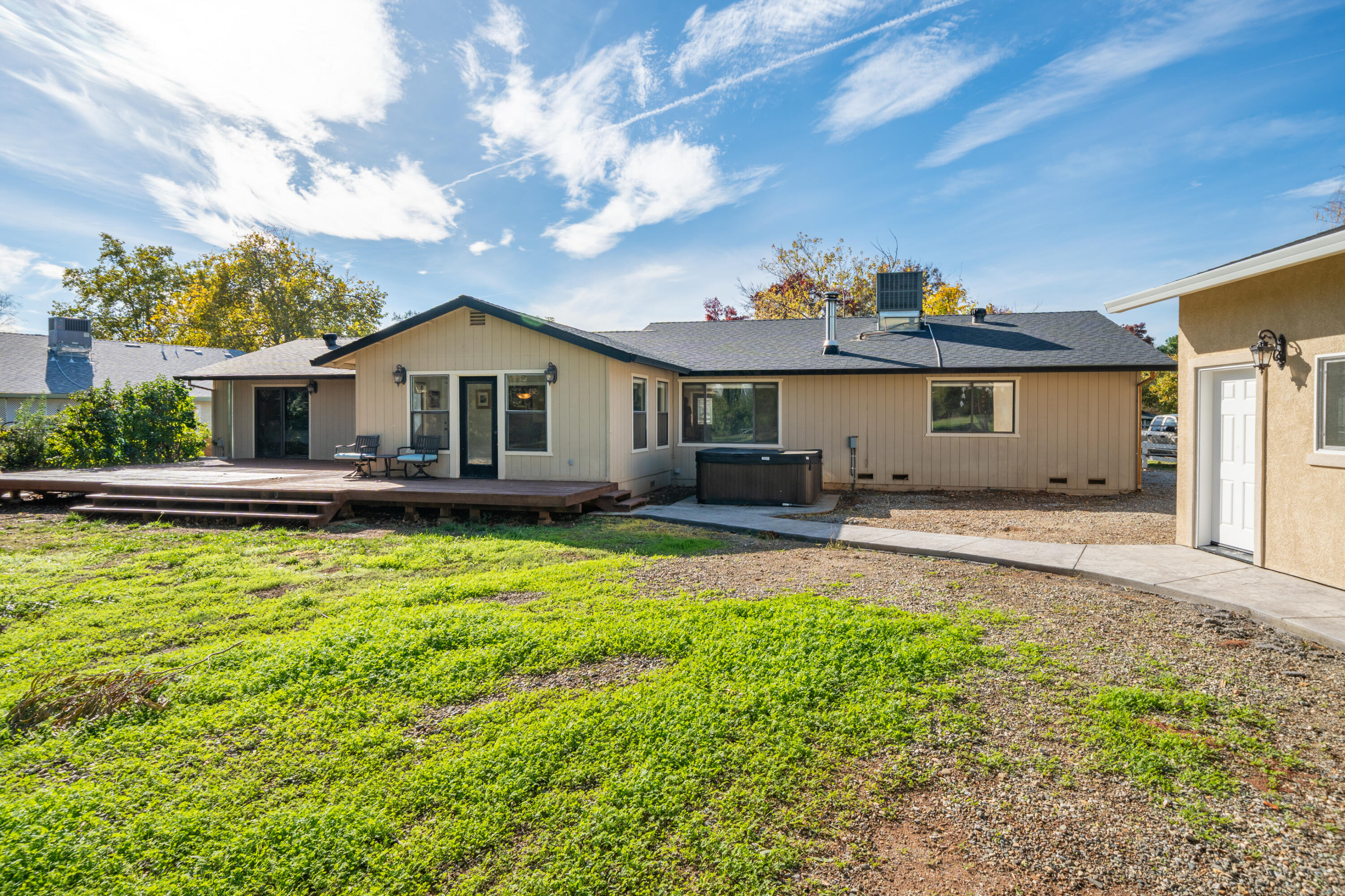 7273 Amigo Way Redding, CA 96002 - Photo 59 of 59 a front view of a house with a yard table and chairs