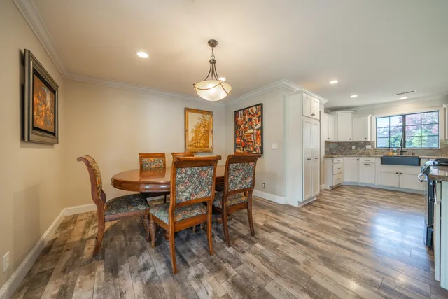 a dining room with furniture and window