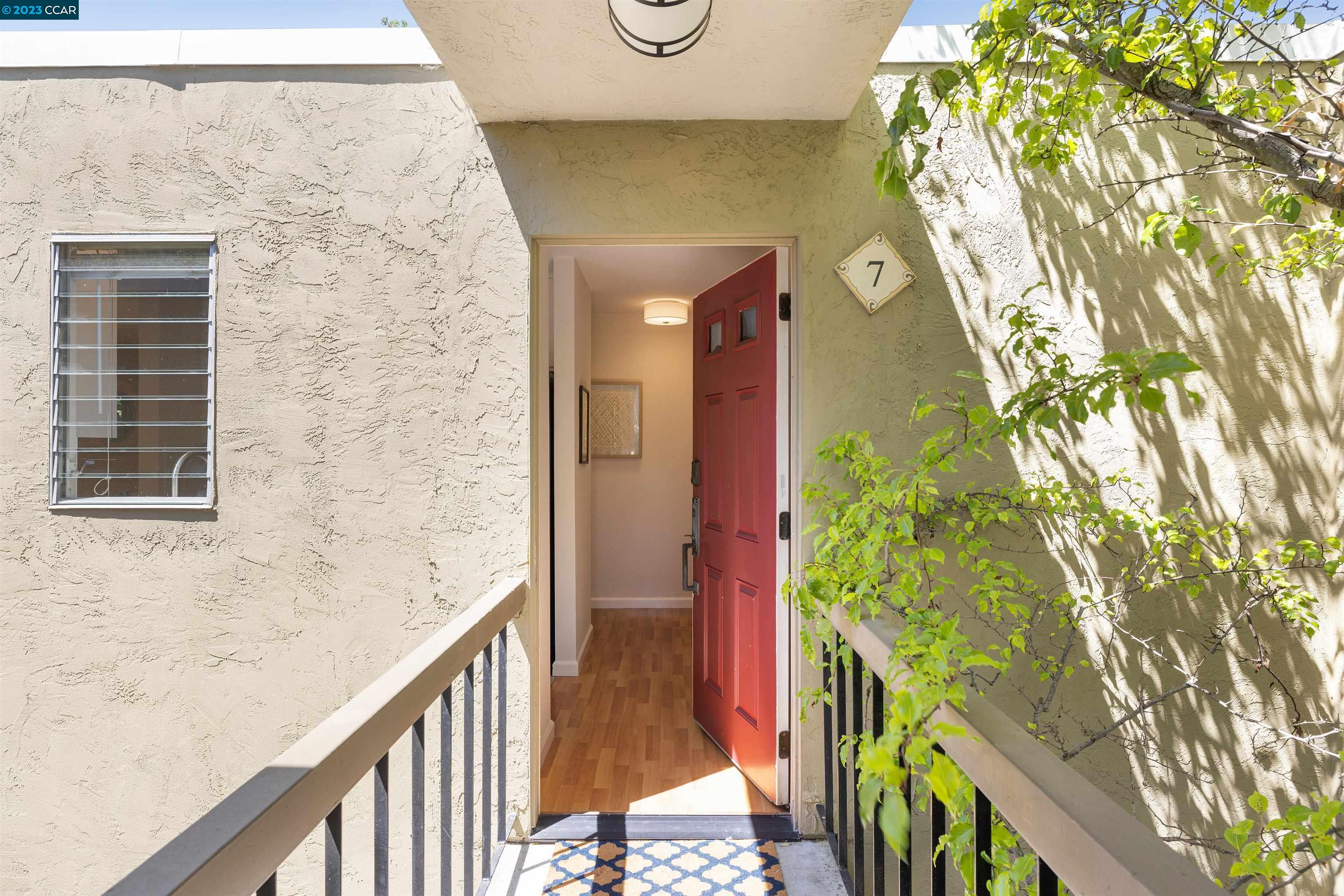 a view of balcony with wooden floor and fence