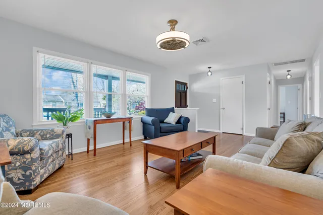 a kitchen with white cabinets and a sink