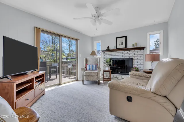 a view of a backyard with plants and a patio