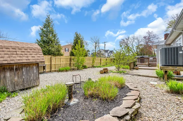 a view of a balcony with wooden floor and outdoor seating