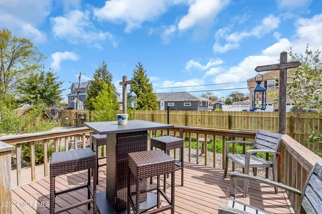 a view of a chair and table in the backyard