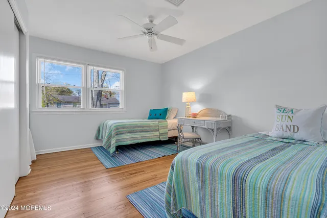 a bedroom with bed and a chandelier