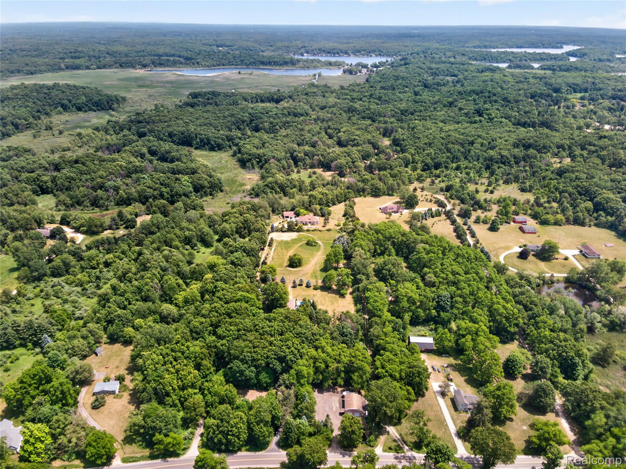 13635 Unadilla Road Gregory, MI 48137 - Photo 53 of 68 Expansive aerial perspective showcasing a vast wooded landscape with scattered clearings