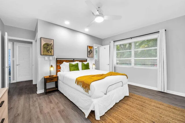 a bedroom with bed and window