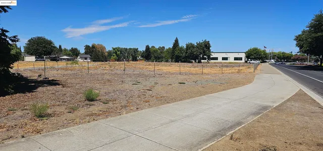 a view of the road and a yard