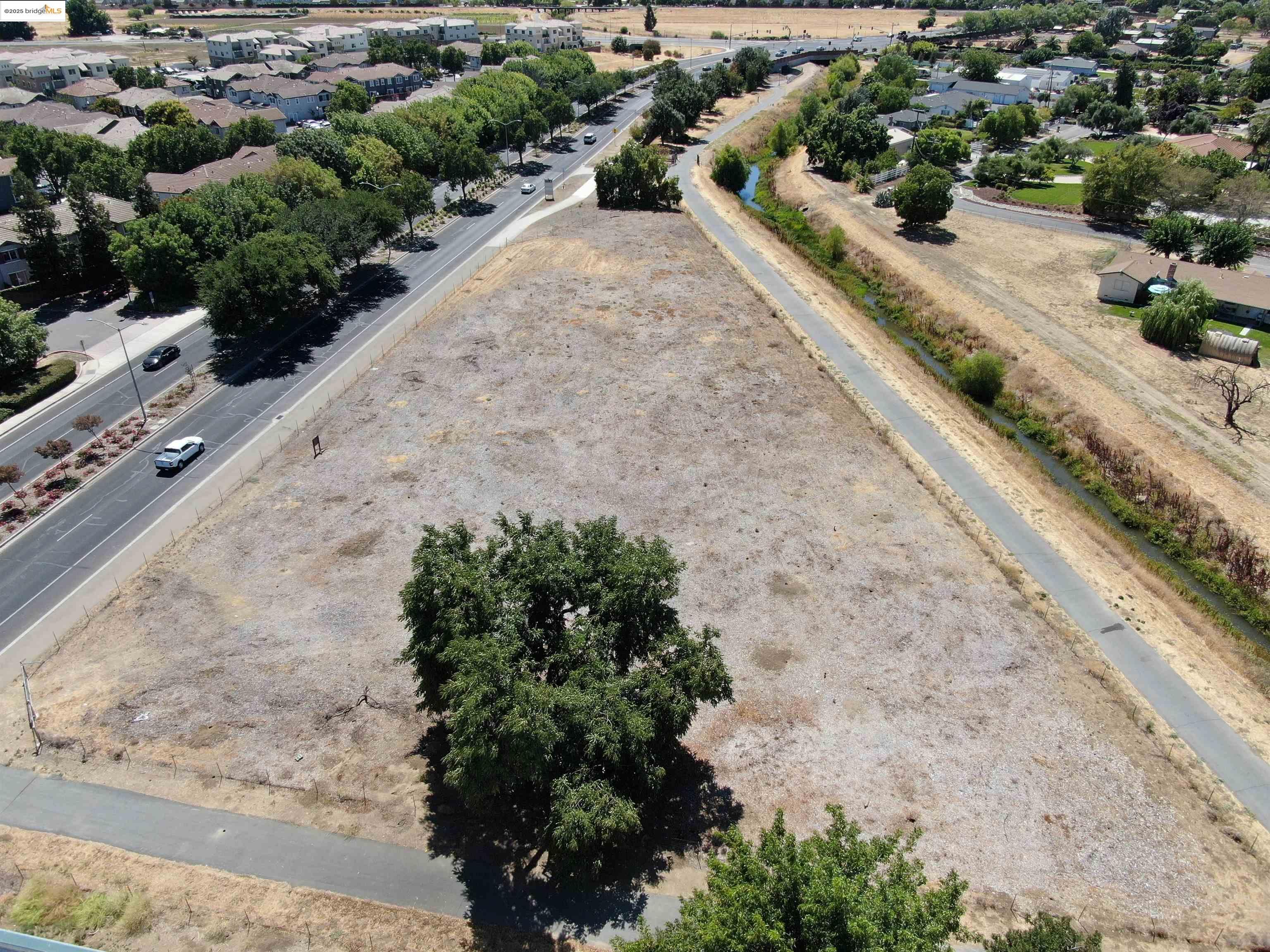 Creek Road Brentwood, CA 94513 - Photo 8 of 9 an aerial view of a house with a yard and mountain view in back