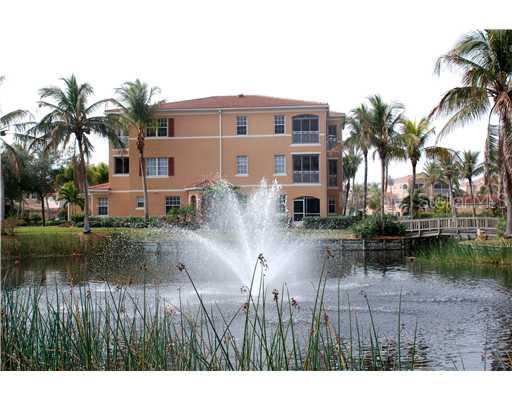 a backyard of a house with swimming pool and outdoor seating