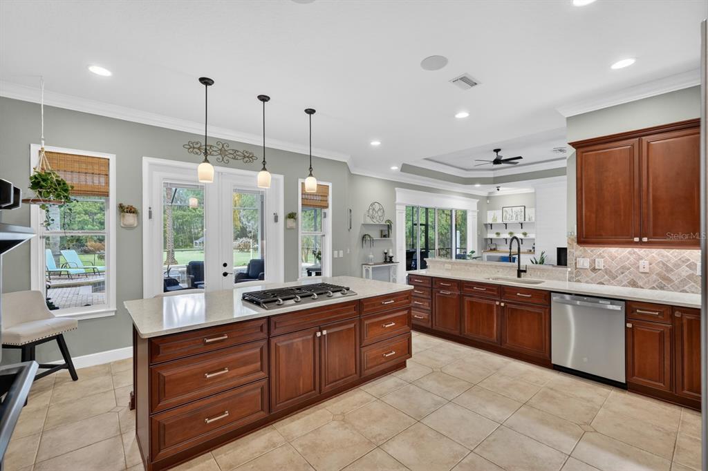 94 Smith Lane Bunnell, FL 32110 - Photo 26 of 80 a large kitchen with kitchen island granite countertop a large counter top and stainless steel appliances