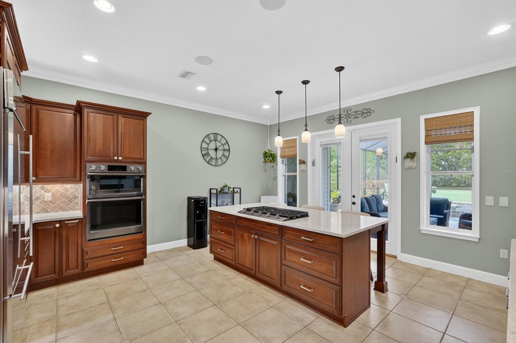 94 Smith Lane Bunnell, FL 32110 - Photo 27 of 80 a kitchen with stainless steel appliances granite countertop a stove and a sink