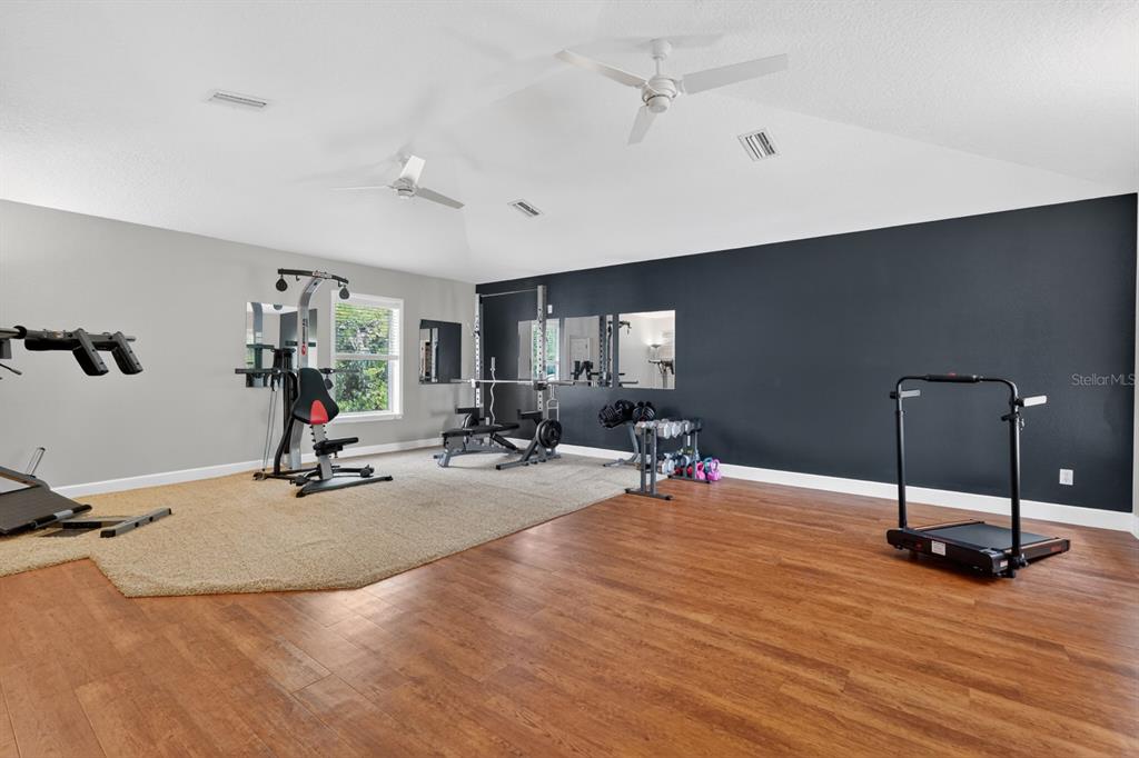 94 Smith Lane Bunnell, FL 32110 - Photo 46 of 80 a view of a room with gym equipment and a large window
