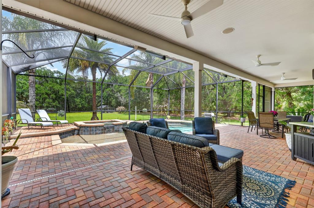 94 Smith Lane Bunnell, FL 32110 - Photo 52 of 80 a living room with patio furniture and a potted plants