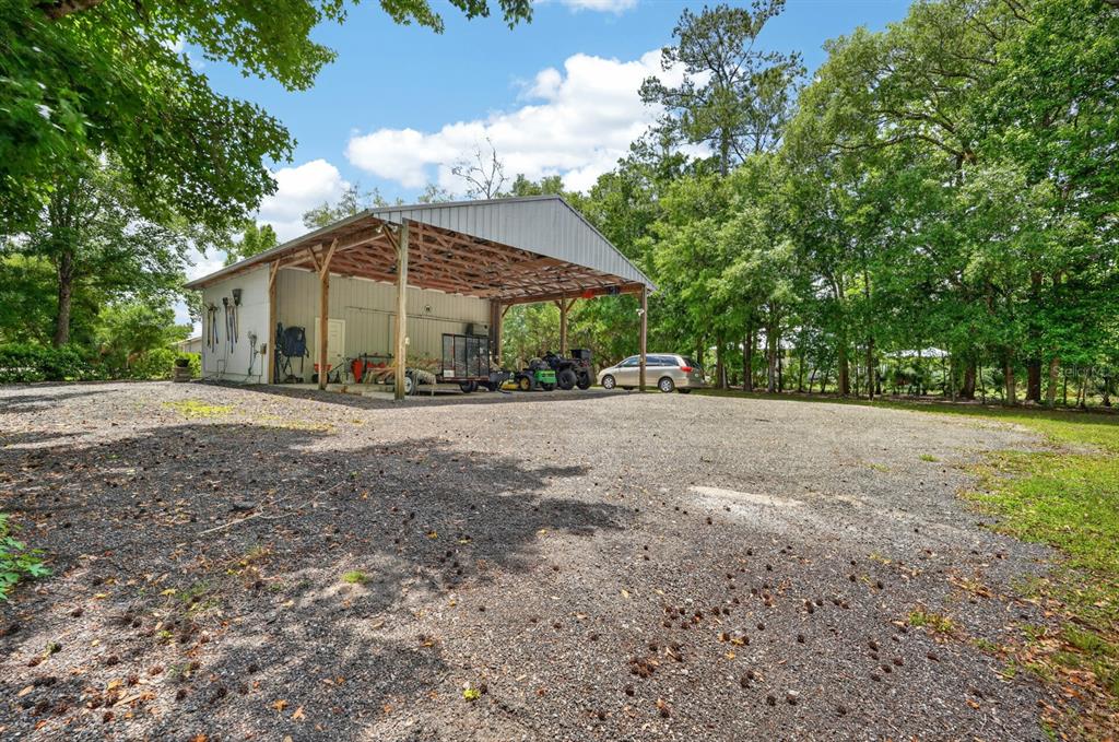 94 Smith Lane Bunnell, FL 32110 - Photo 63 of 80 a view of a house with yard and a garden