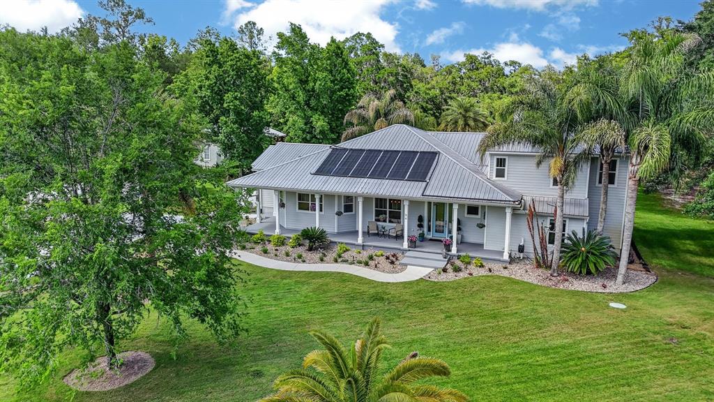 94 Smith Lane Bunnell, FL 32110 - Photo 76 of 80 a view of a house with a yard table and chairs