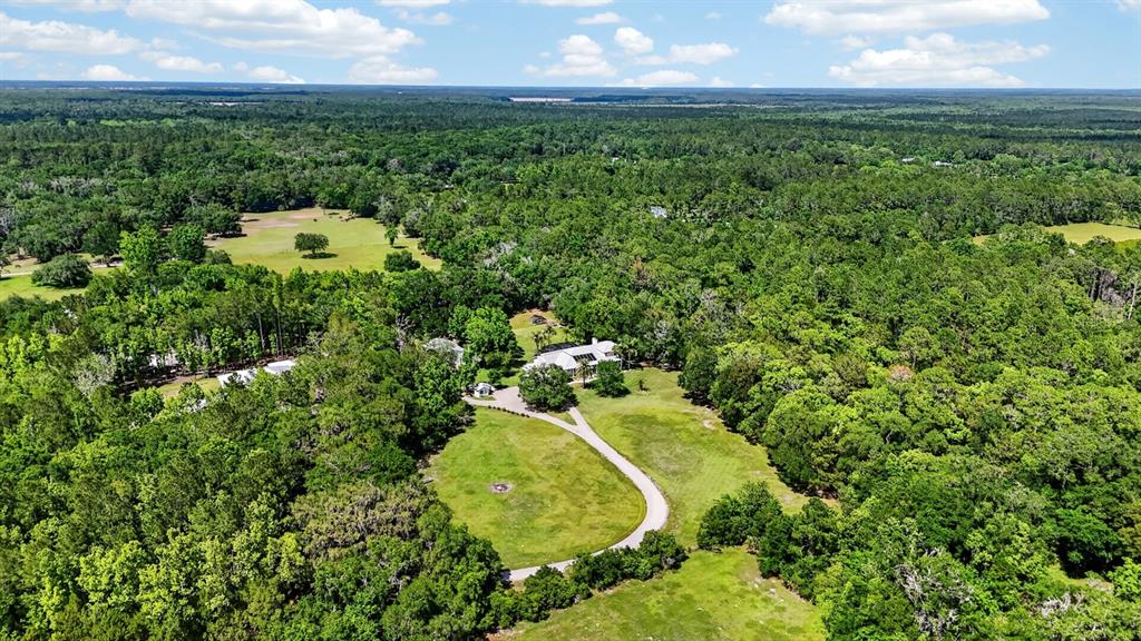 94 Smith Lane Bunnell, FL 32110 - Photo 79 of 80 an aerial view of a house with a yard and lake view