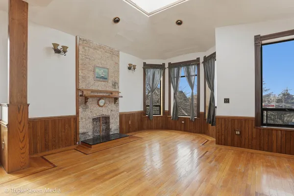 a view of hallway with wooden floor
