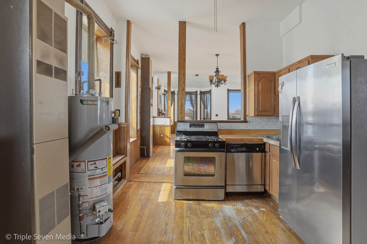 3315 South Wood Street Chicago, IL 60608 - Photo 39 of 80 a kitchen with stainless steel appliances granite countertop a refrigerator and a stove