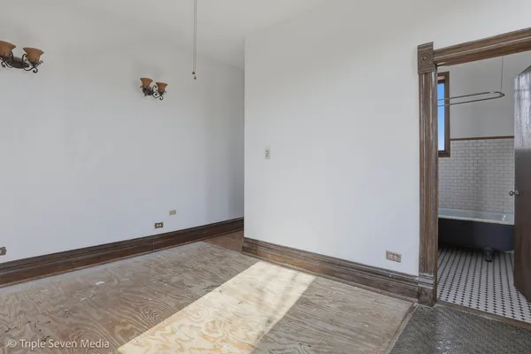 a kitchen with stainless steel appliances granite countertop a refrigerator a stove and a sink with cabinets
