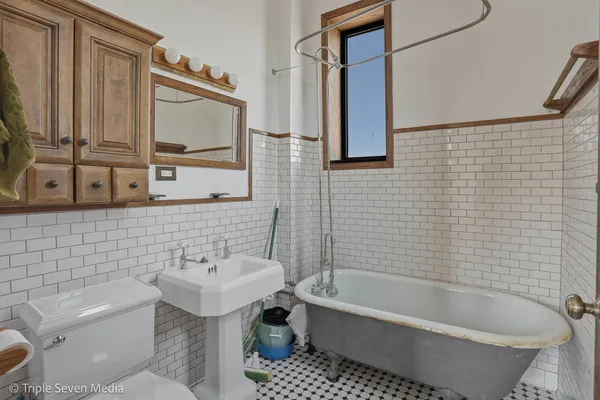 a kitchen with stainless steel appliances granite countertop a refrigerator stove and sink