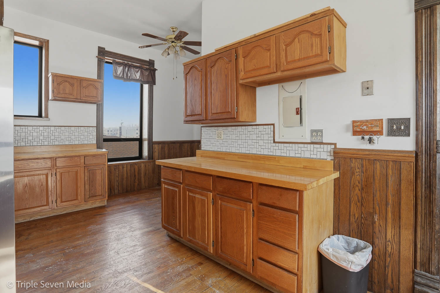 3315 South Wood Street Chicago, IL 60608 - Photo 48 of 80 a kitchen with stainless steel appliances a sink cabinets and wooden floor
