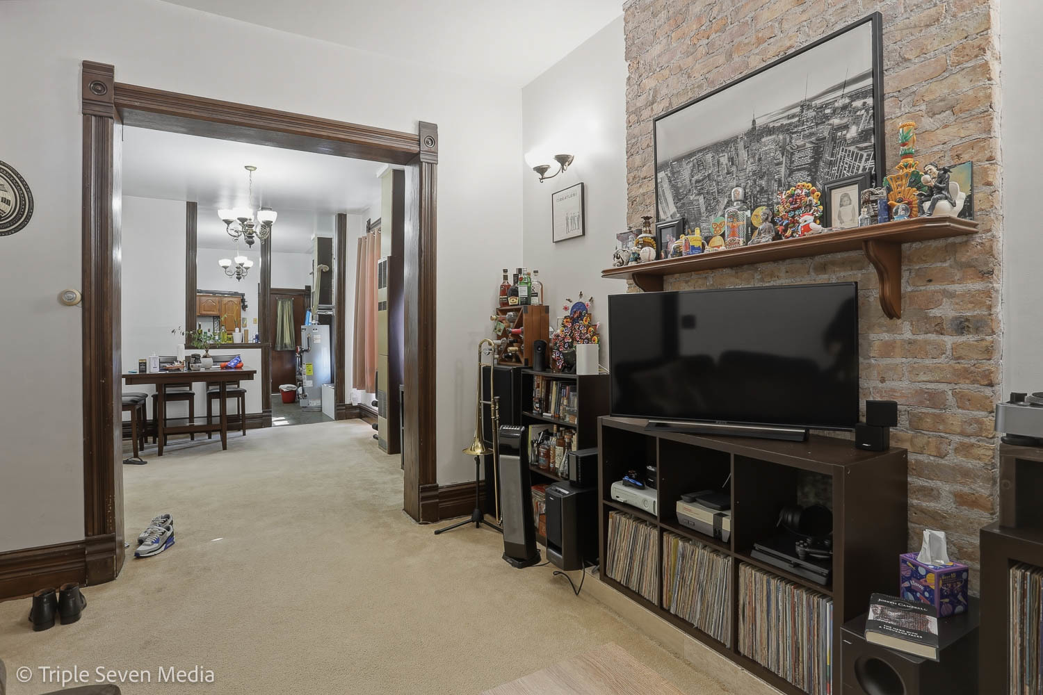 3315 South Wood Street Chicago, IL 60608 - Photo 52 of 80 a living room with furniture a flat screen tv and a fireplace