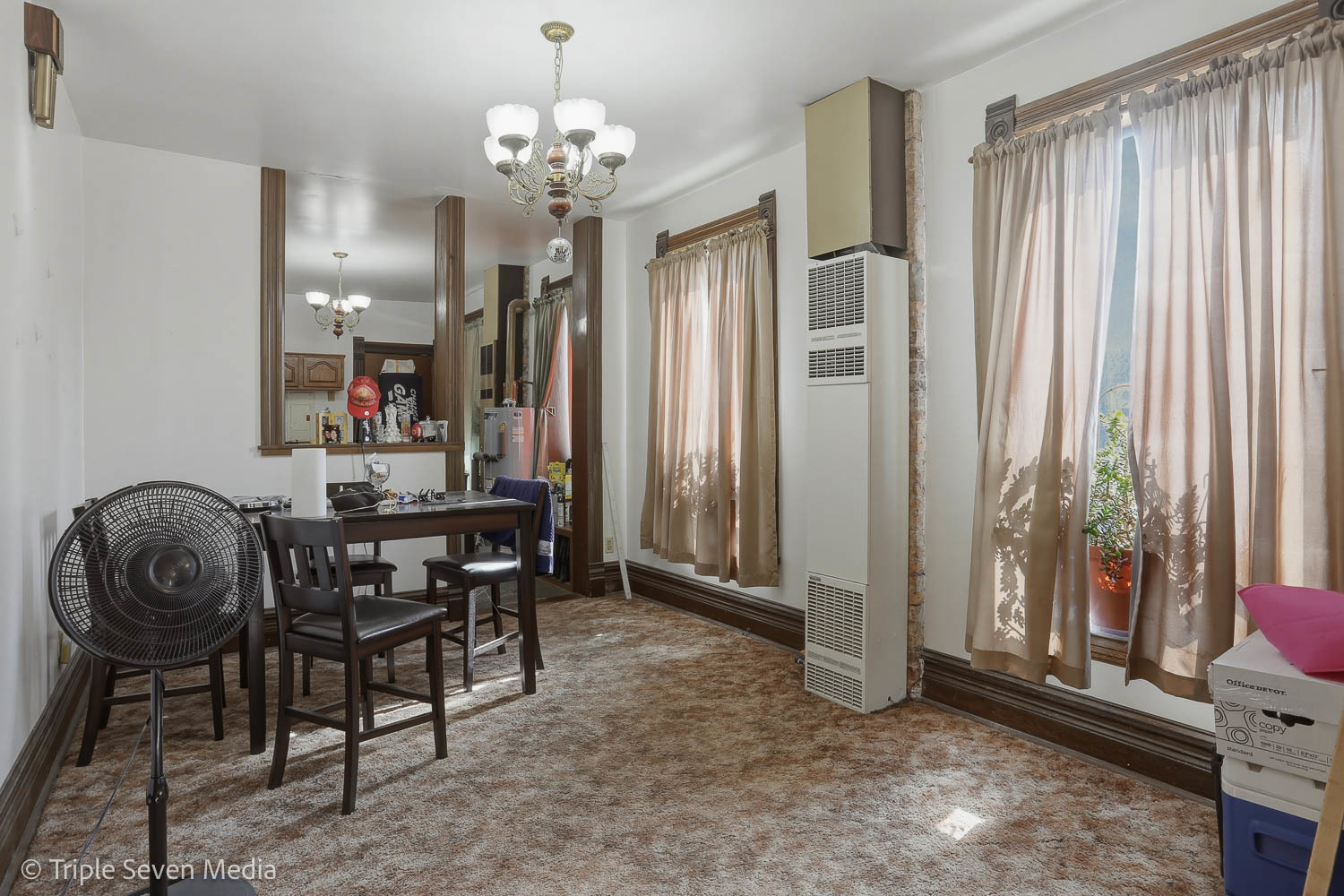 3315 South Wood Street Chicago, IL 60608 - Photo 67 of 80 a view of a dining room with furniture and chandelier