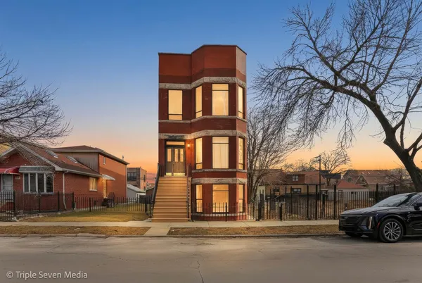 a view of a building with a backyard