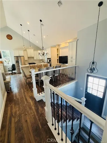 a view of kitchen center island dining table wooden floor and window